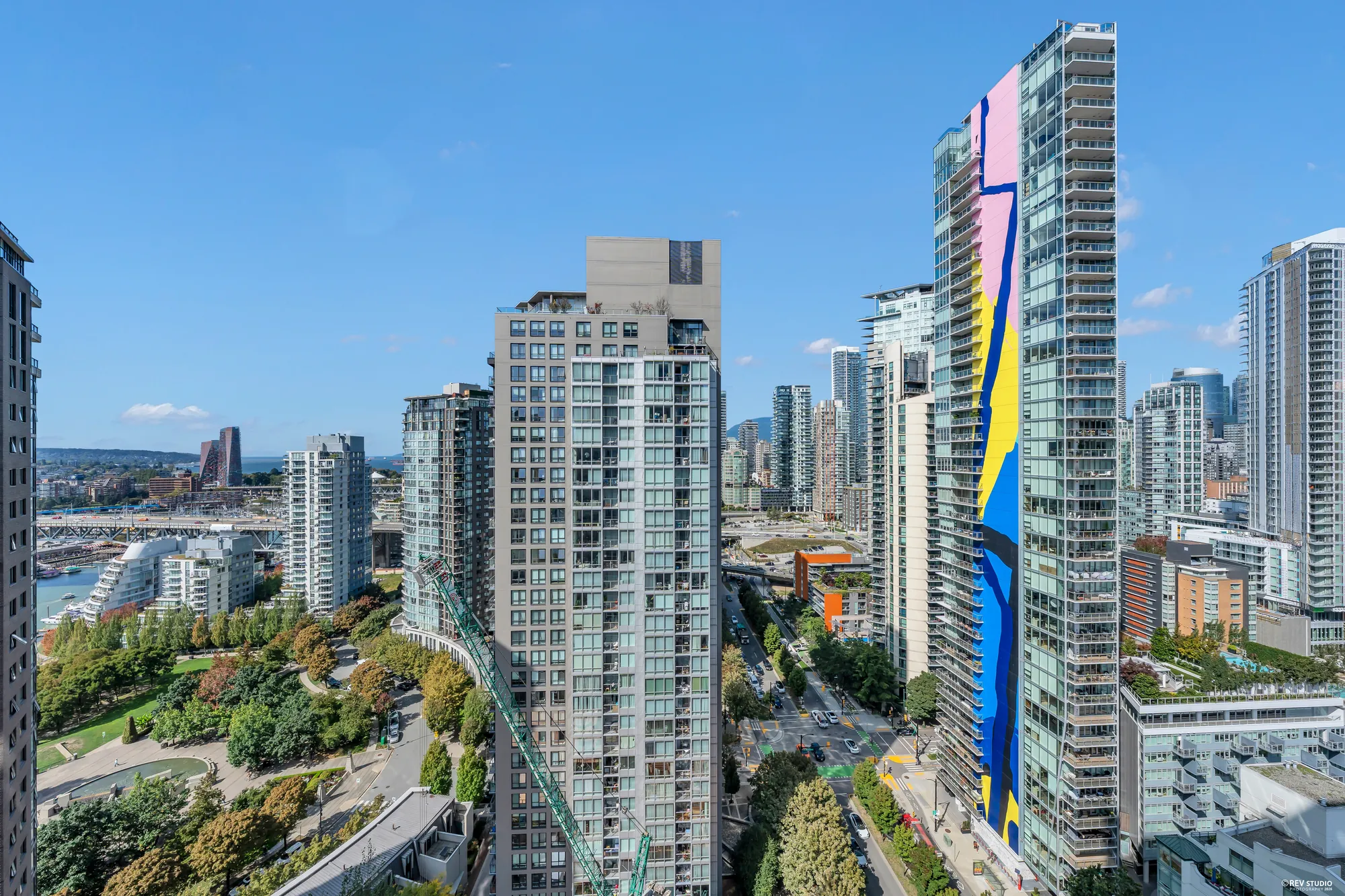 From the balcony: David Lam Park's lawns and paths, the towers beyond, the mountains on the skyline