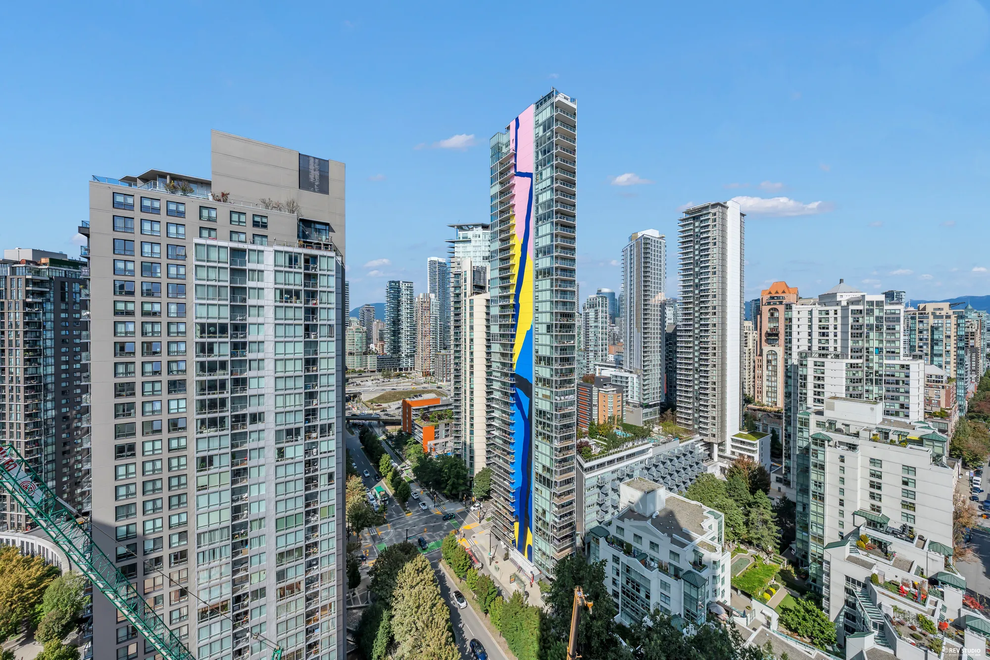From the balcony toward the north: the towers of Yaletown and downtown, a painted tower among them